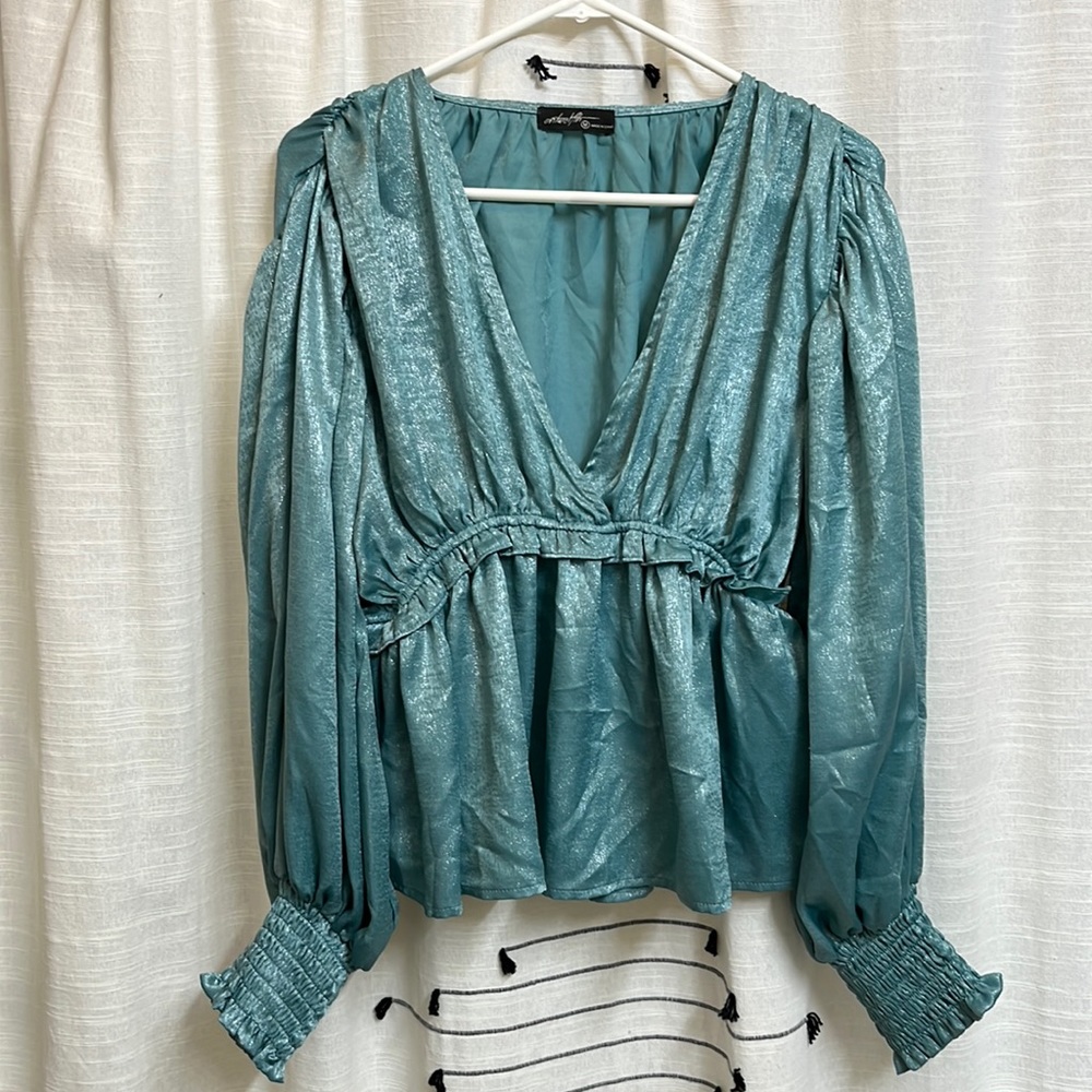 Fancy, metallic/shiny peplum balloon sleeve blouse